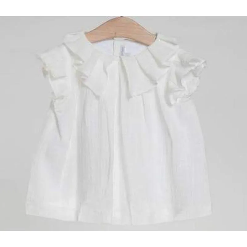Blouse à volants crème avec jupe texturée rose