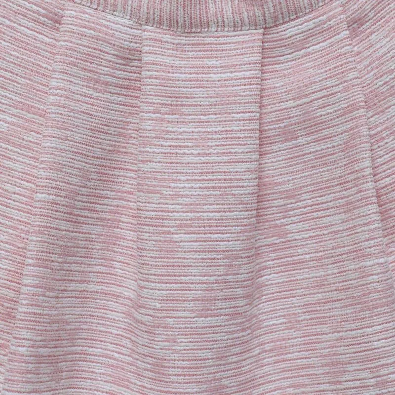 Blouse à volants crème avec jupe texturée rose