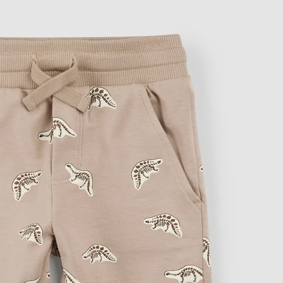 Short taupe avec empreinte de fossile de dinosaure par miles the label