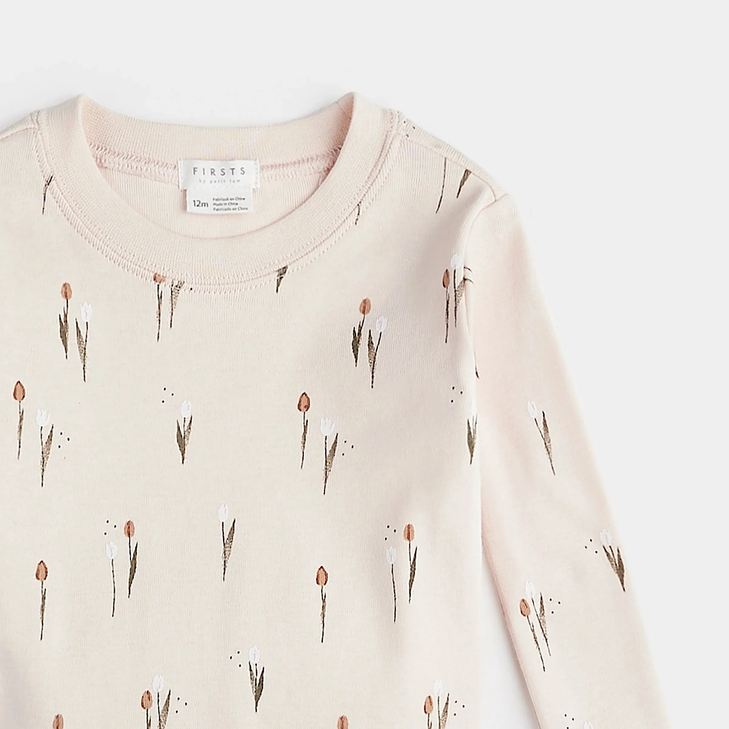 Pyjama pour bébé FIRSTS à motifs tulipe sur fond crème