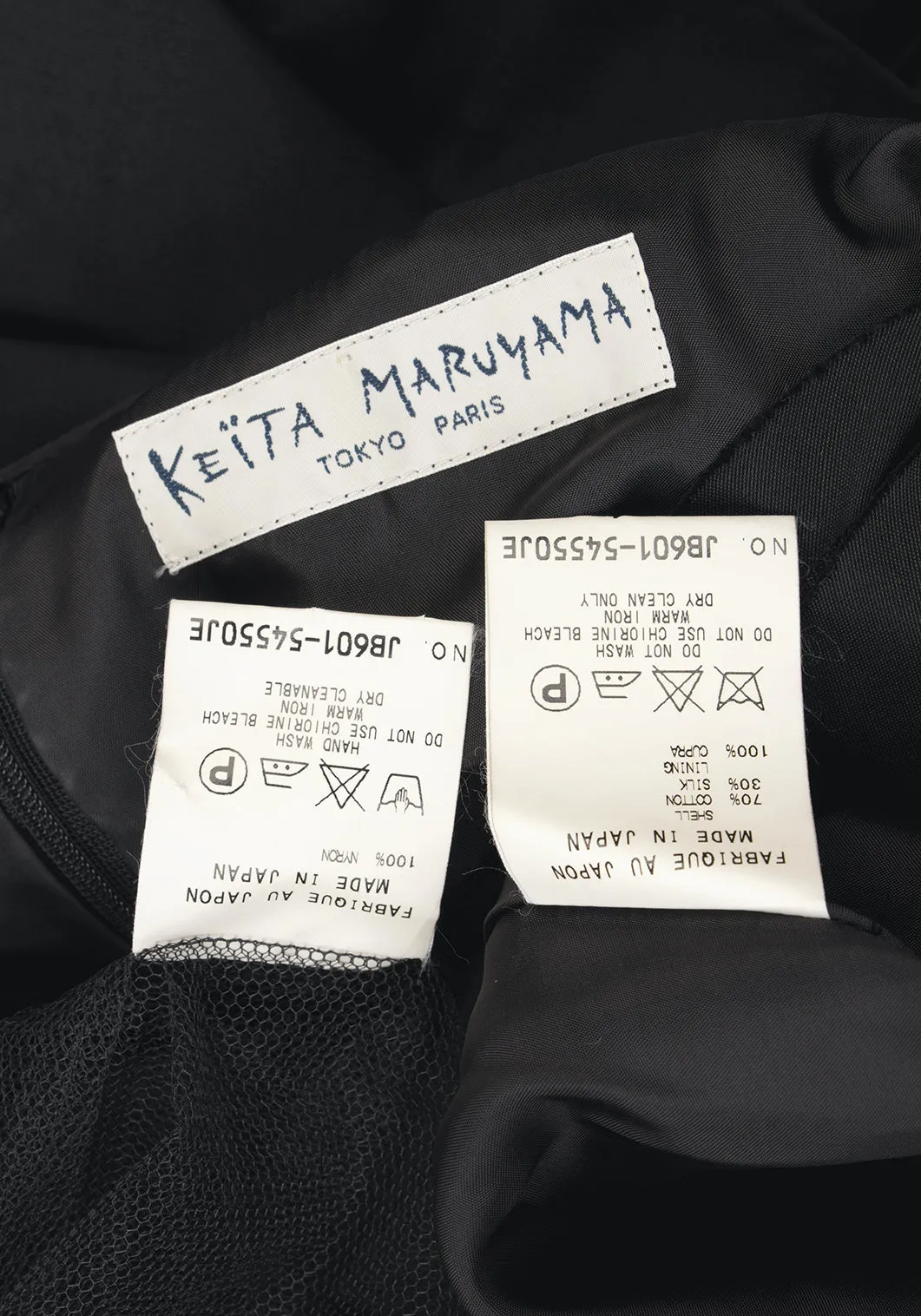 KEITA MARUYAMA Japon. Robe sans manches noire à motifs découpés