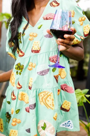 Robe à manches ballon avec vin mentholé et charcuterie