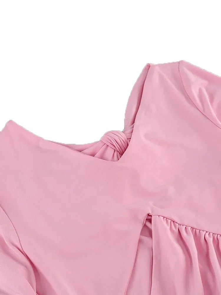 Robe maxi rose avec nœuds et découpes